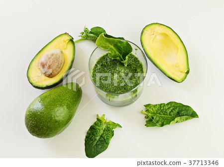 Glass with fresh smoothie from spinach and avocado Glass with fresh smoothie from spinach and avocado 37713346
