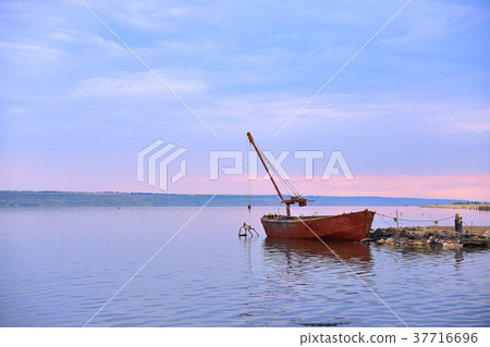 Old Rusty Boat On River After Sunset Old Rusty Boat On River After Sunset 37716696