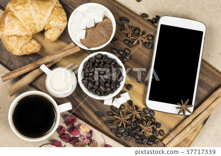 Top view of black coffee white cup with croissant  37717339