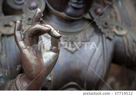 Detail of Buddha statue with Karana mudra hand 37719512