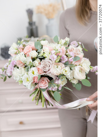 beautiful luxury bouquet of mixed flowers in woman 37720074