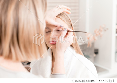 Paint eyes. Makeup artist creating beautiful Paint eyes. Makeup artist creating beautiful 37720141