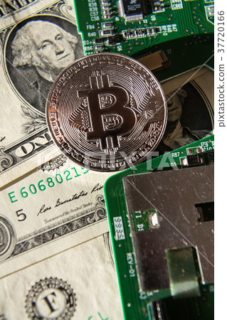 Silver bitcoin with dollars computer motherboard Silver bitcoin with dollars computer motherboard 37720166