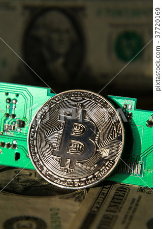 Silver bitcoin with dollars computer motherboard Silver bitcoin with dollars computer motherboard 37720169