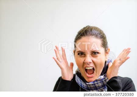 Woman in Glasses Gesturing to Someone on the Left 37720380