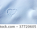 Heart symbol written in the snow 37720605