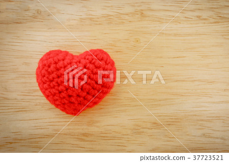 Red heart knit with yarn on wooden floor 37723521