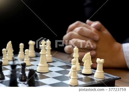 Businessman thinking how to win Businessman thinking how to win 37723759