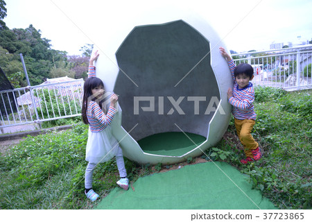 Sister and brother playing in the park Sister and brother playing in the park 37723865