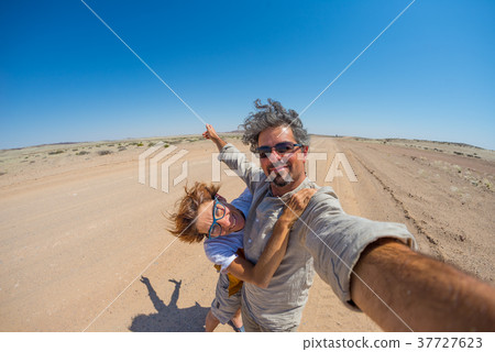 Adult couple taking selfie in the Namib desert 37727623