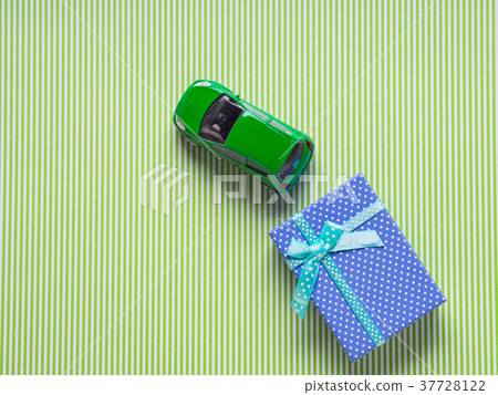 Blue gift box and a toy car 37728122
