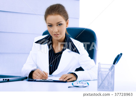Attractive businesswoman working with laptop 37728963