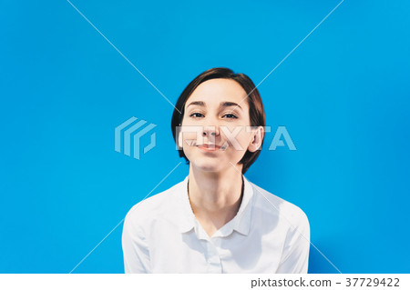 Portrait of a smiling young woman (colorful background) Portrait of a smiling young woman (colorful background) 37729422