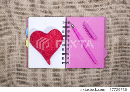 Notebook with ballpoint pen and red heart Notebook with ballpoint pen and red heart 37729786