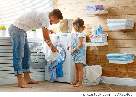 Happy family man father householder and child in laundry with Happy family man father householder and child in laundry with 37731405