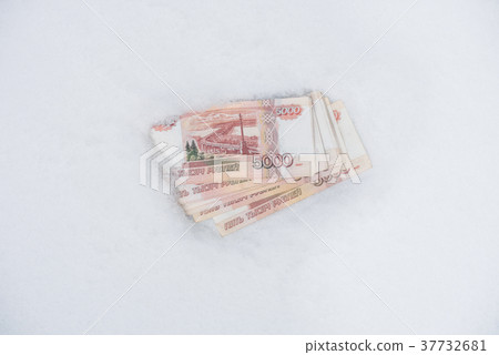 Five thousand russian roubles banknotes on snow Five thousand russian roubles banknotes on snow 37732681