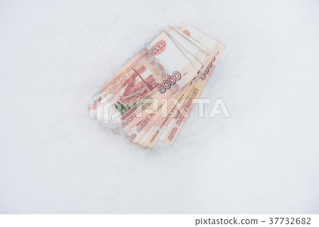 Five thousand russian roubles banknotes on snow Five thousand russian roubles banknotes on snow 37732682