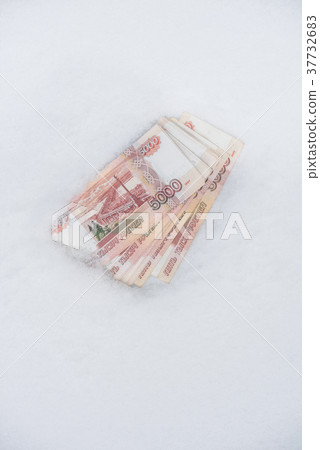 Five thousand russian roubles banknotes on snow Five thousand russian roubles banknotes on snow 37732683
