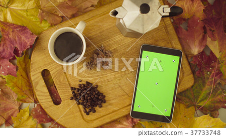 Autumn still life. Chroma key tablet and coffee 37733748