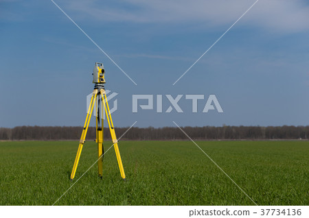 Surveyor equipment outdoors theodolite on tripod Surveyor equipment outdoors theodolite on tripod 37734136