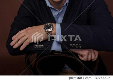 Modern accessory locating on arm of businessman Modern accessory locating on arm of businessman 37736696