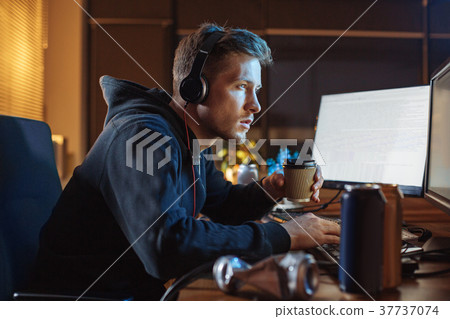 Orderly male working with gadgets 37737074