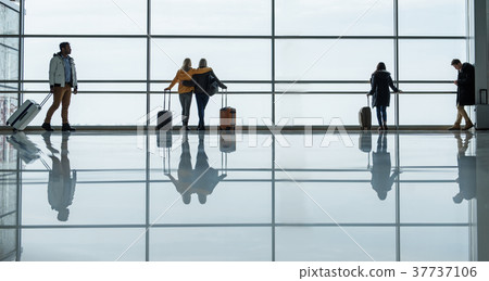 Men and women are spending time at terminal with 37737106