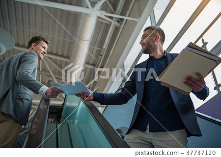 Men are keeping contract on staircase 37737120