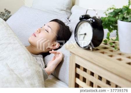Alarm clock and young lady 37739376