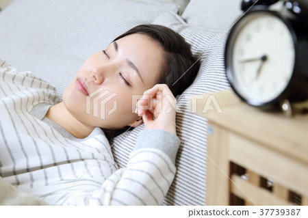 Alarm clock and young lady Alarm clock and young lady 37739387