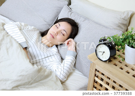 Alarm clock and young lady 37739388