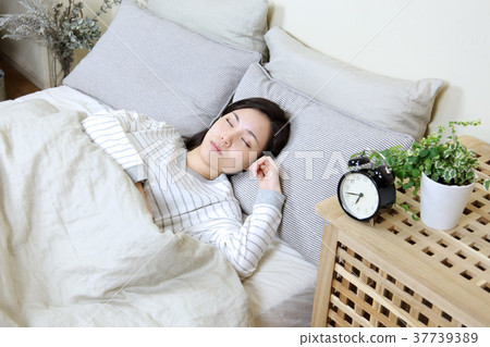 Alarm clock and young lady 37739389