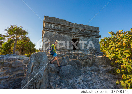 Kid climbing on the top of antique ruins 37740344