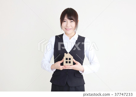 A woman with a housing model A woman with a housing model 37747233