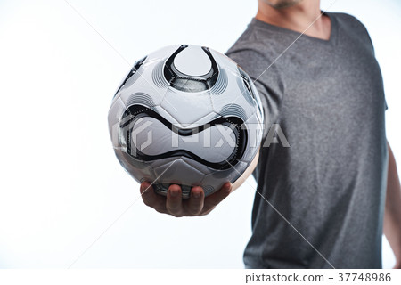 Football ball in player hand Football ball in player hand 37748986