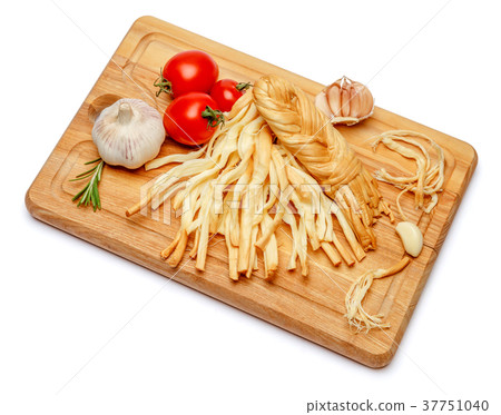 Smoked braided cheese and vegetables on white 37751040