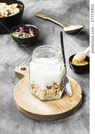 Granola with yogurt, honey, nuts, fruit 37753909