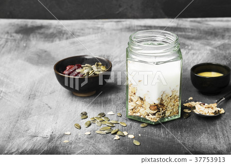 Granola with yogurt, honey, nuts, fruit 37753913