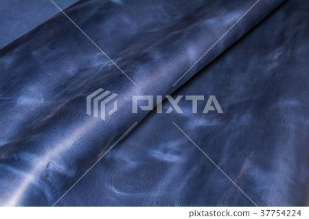 Piece of blue leather. Texture of natural material. 37754224