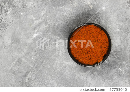 Red hot pepper on a gray background. Top view Red hot pepper on a gray background. Top view 37755040