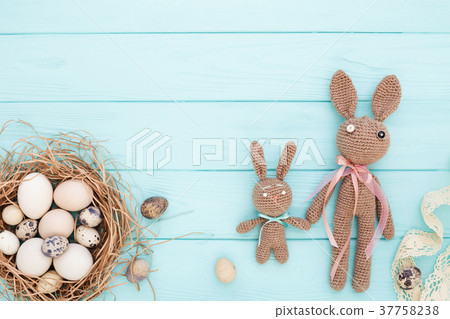 Easter flat lay with eggs and Easter bunnies Easter flat lay with eggs and Easter bunnies 37758238