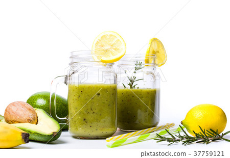 Avocado smoothie in a glass isolated Avocado smoothie in a glass isolated 37759121