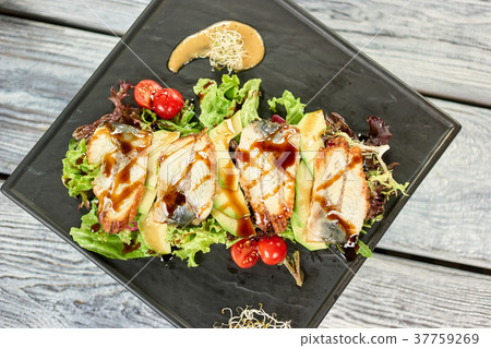 Salad with fish, avocado and sauce. Salad with fish, avocado and sauce. 37759269