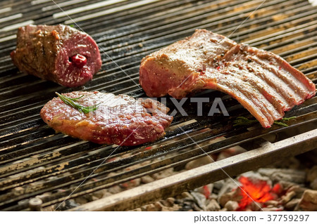 Grilling pieces of pork. Grilling pieces of pork. 37759297
