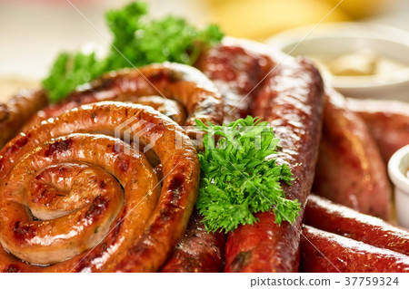 Juicy sausage spirals, closeup. Juicy sausage spirals, closeup. 37759324