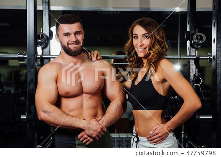 young sexy beautiful fitness couple is exercising young sexy beautiful fitness couple is exercising 37759798