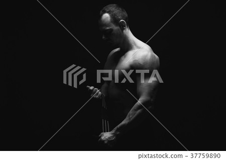 Strong athletic man showes naked muscular body Strong athletic man showes naked muscular body 37759890