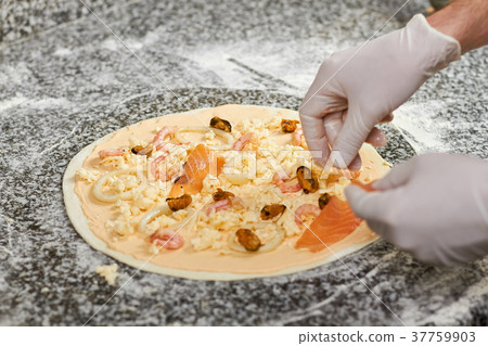 Pizza with seafood cooking. Pizza with seafood cooking. 37759903