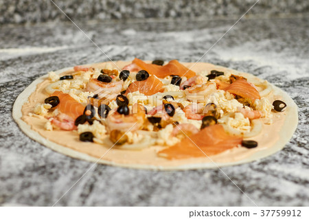 Close up unbaked seafood pizza with ingredients. Close up unbaked seafood pizza with ingredients. 37759912