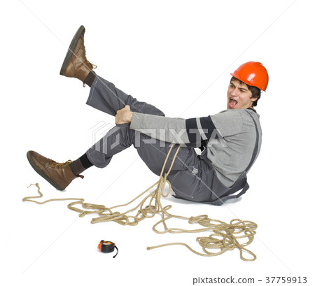 A young worker in grey uniform tied up with rope A young worker in grey uniform tied up with rope 37759913